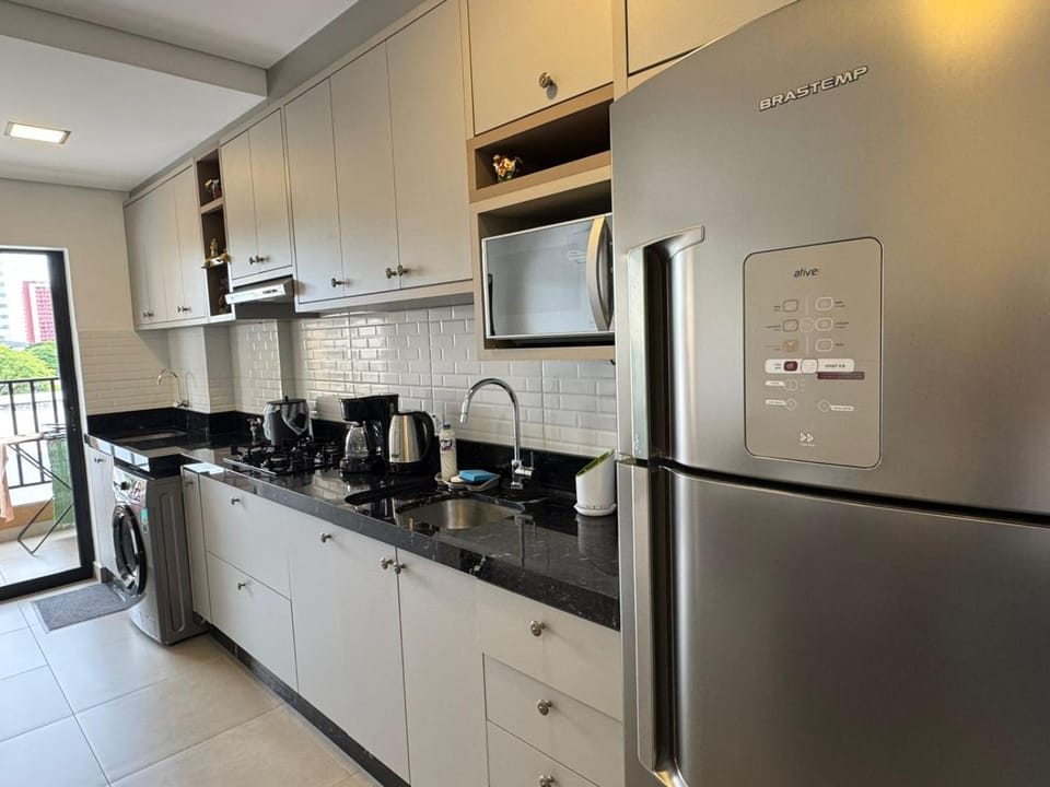 Kitchen or kitchenette, microwave, stove, toaster