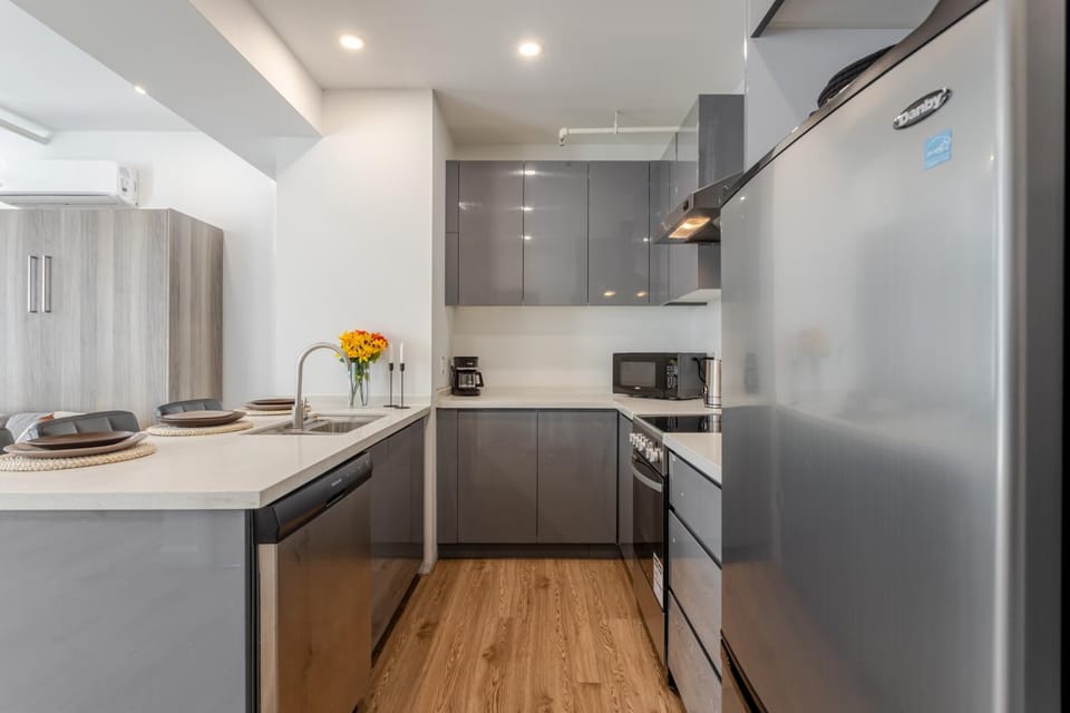 Kitchen or kitchenette, dishwasher, oven, stove, toaster