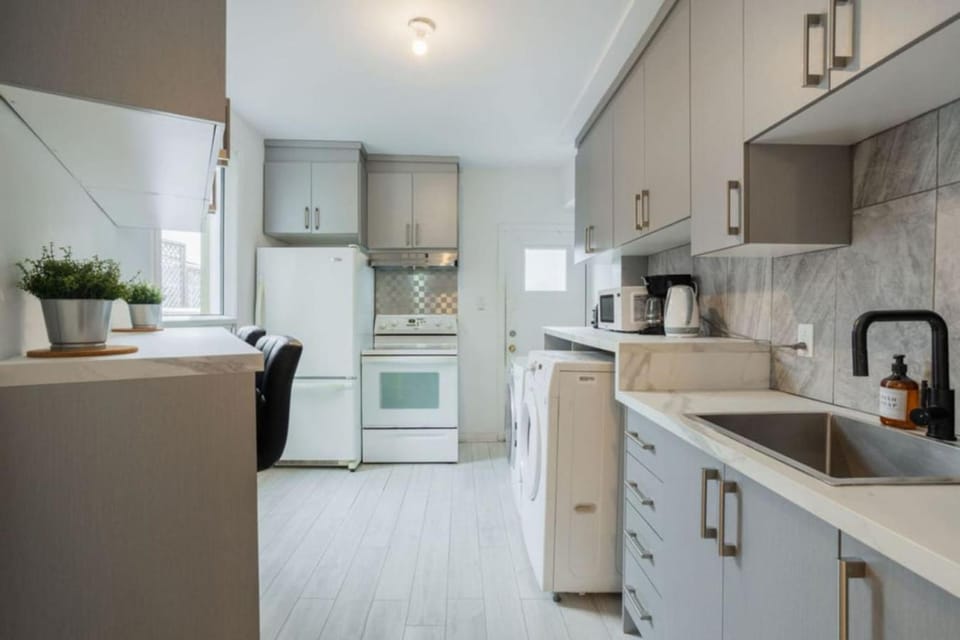 Kitchen or kitchenette, dishwasher, stove, toaster, washing machine, dryer