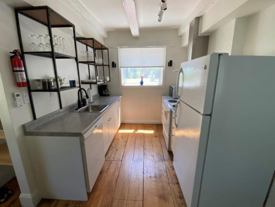 Kitchen or kitchenette, dishwasher, oven, stove