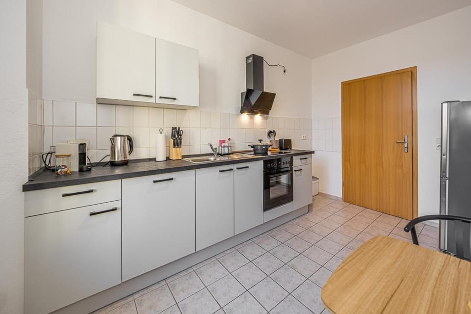 Kitchen or kitchenette, dishwasher, oven, stove, toaster