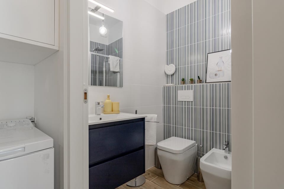 Shower, Toilet, Bathroom, bidet, towels, washing machine