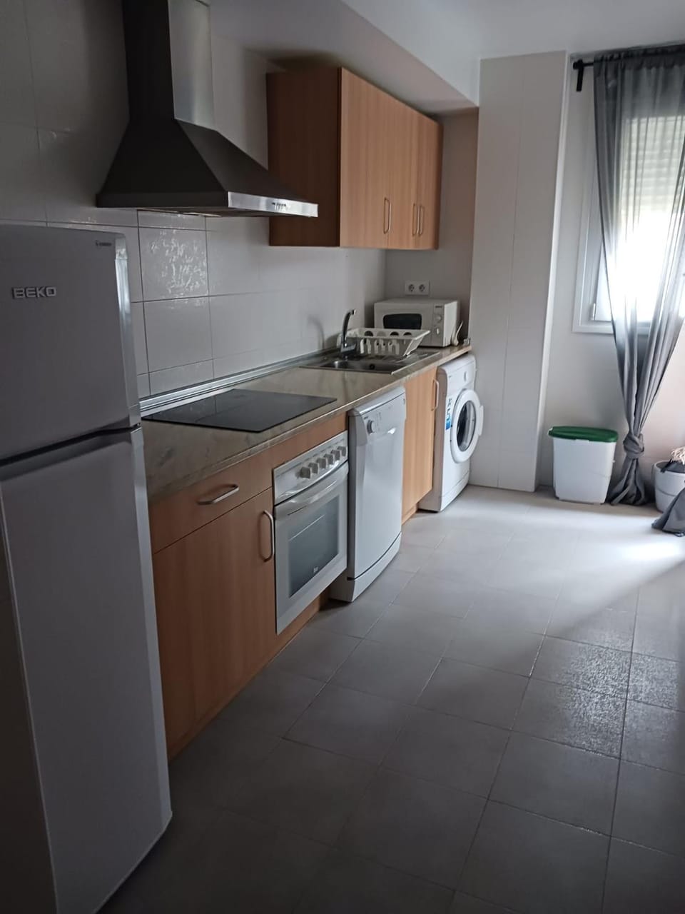Kitchen or kitchenette, dishwasher, oven, stove, washing machine