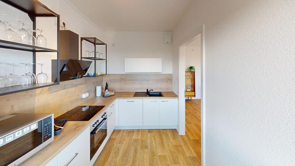 Kitchen or kitchenette, dishwasher, oven, stove