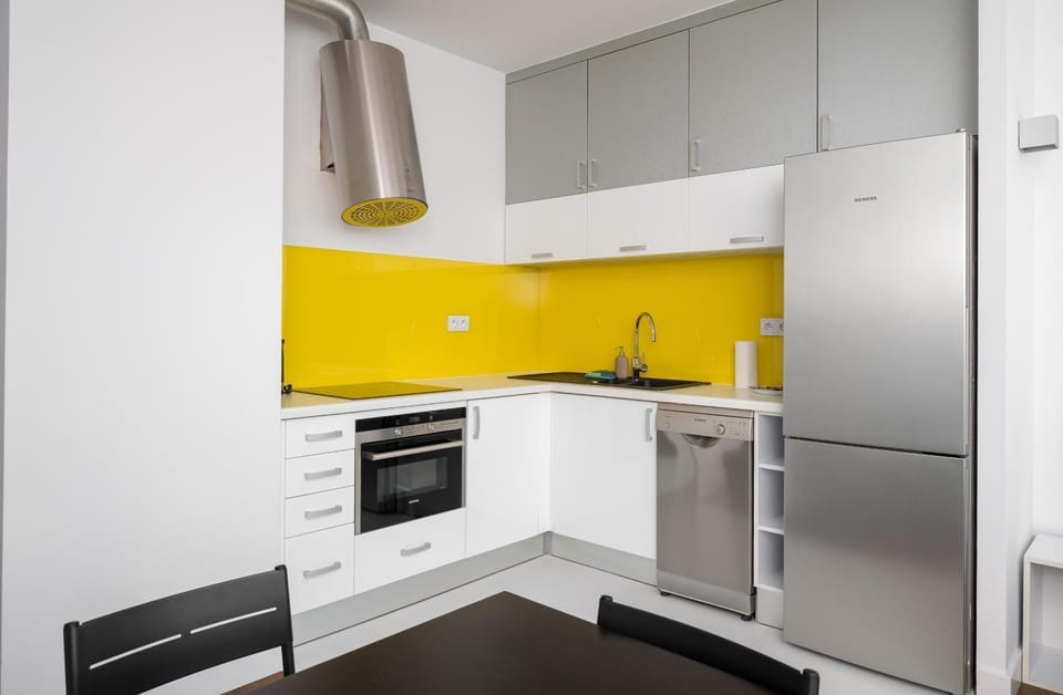 Kitchen or kitchenette, dishwasher, oven, stove