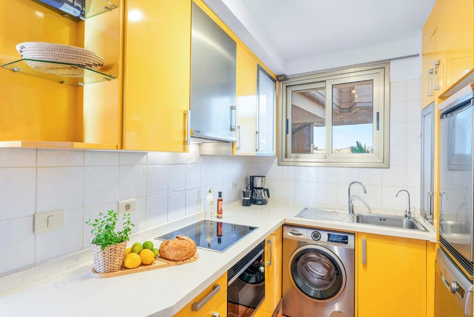 Kitchen or kitchenette, oven, stove, washing machine