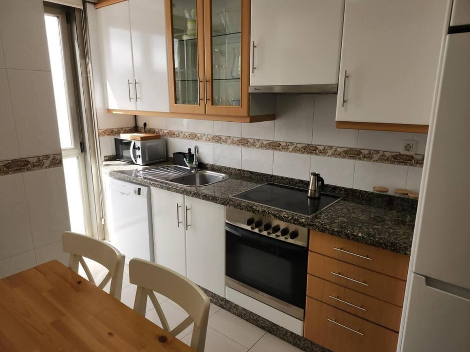 Kitchen or kitchenette, dishwasher, oven, stove, toaster