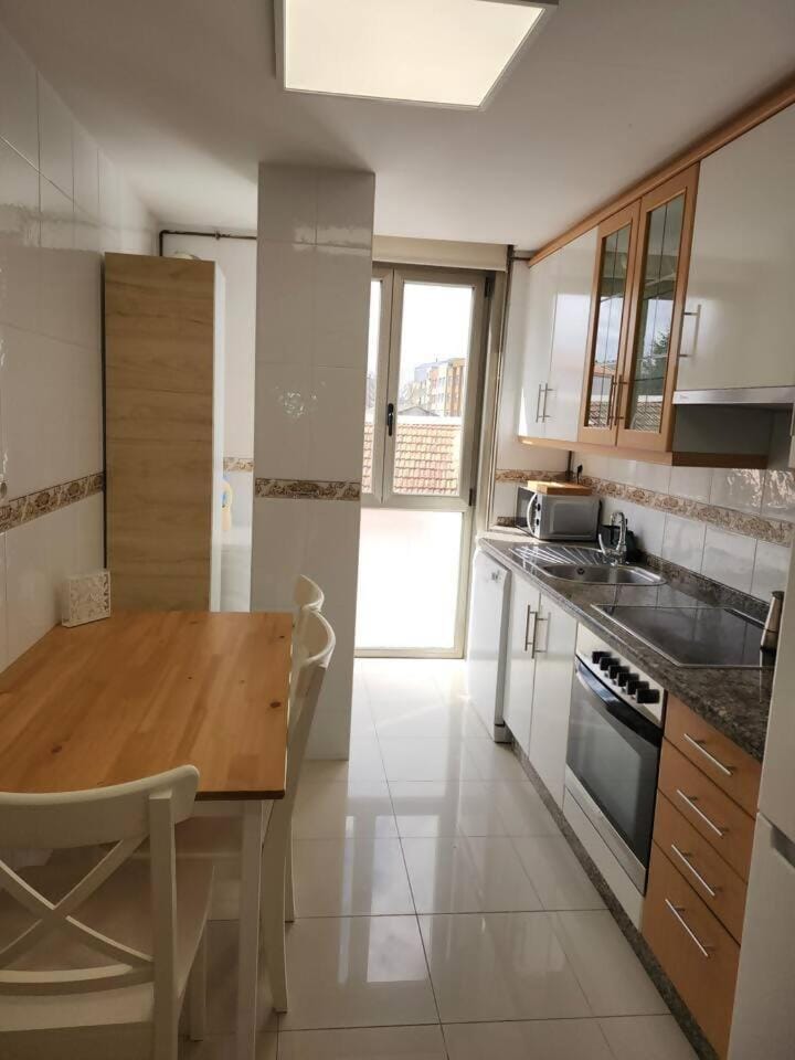 Kitchen or kitchenette, dishwasher, oven, stove