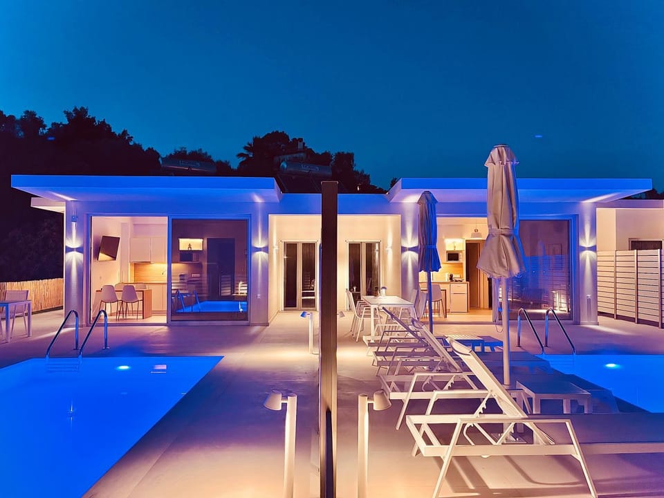 Property building, Night, Pool view, Swimming pool, sunbed