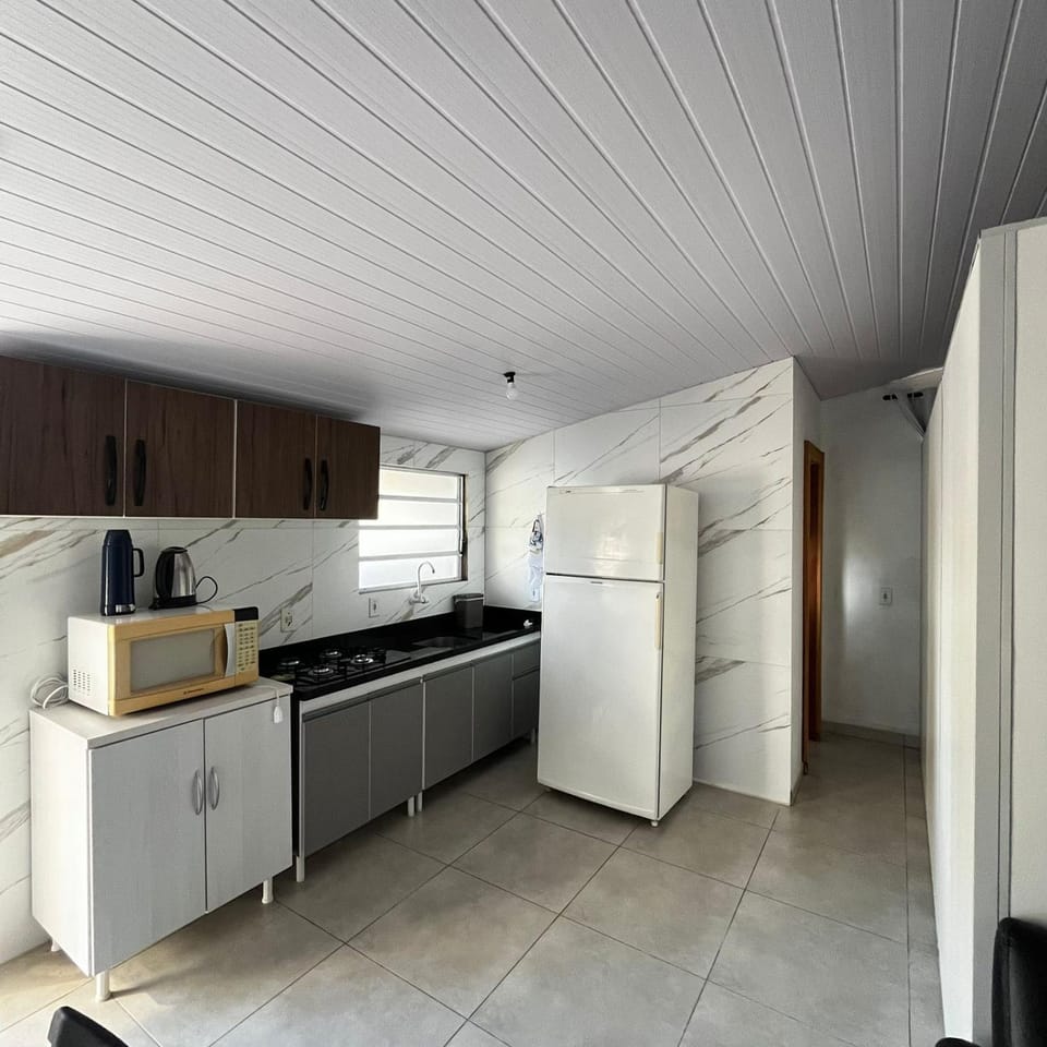 Kitchen or kitchenette, dishwasher, oven, stove