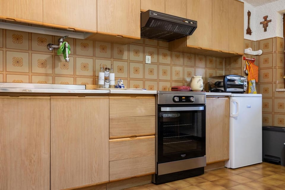 Kitchen or kitchenette, dishwasher, oven, stove, toaster