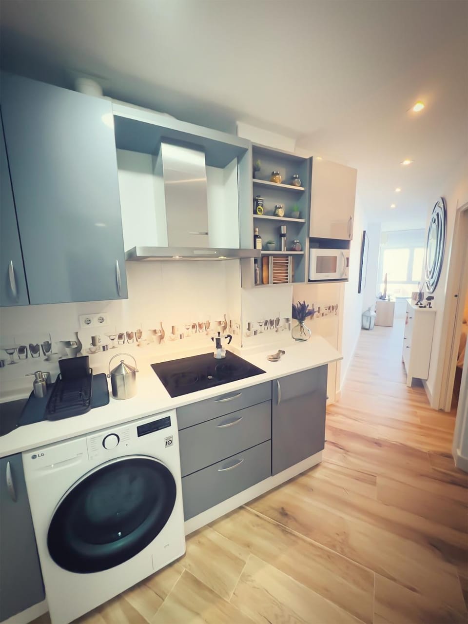 Kitchen or kitchenette, stove, washing machine, dryer