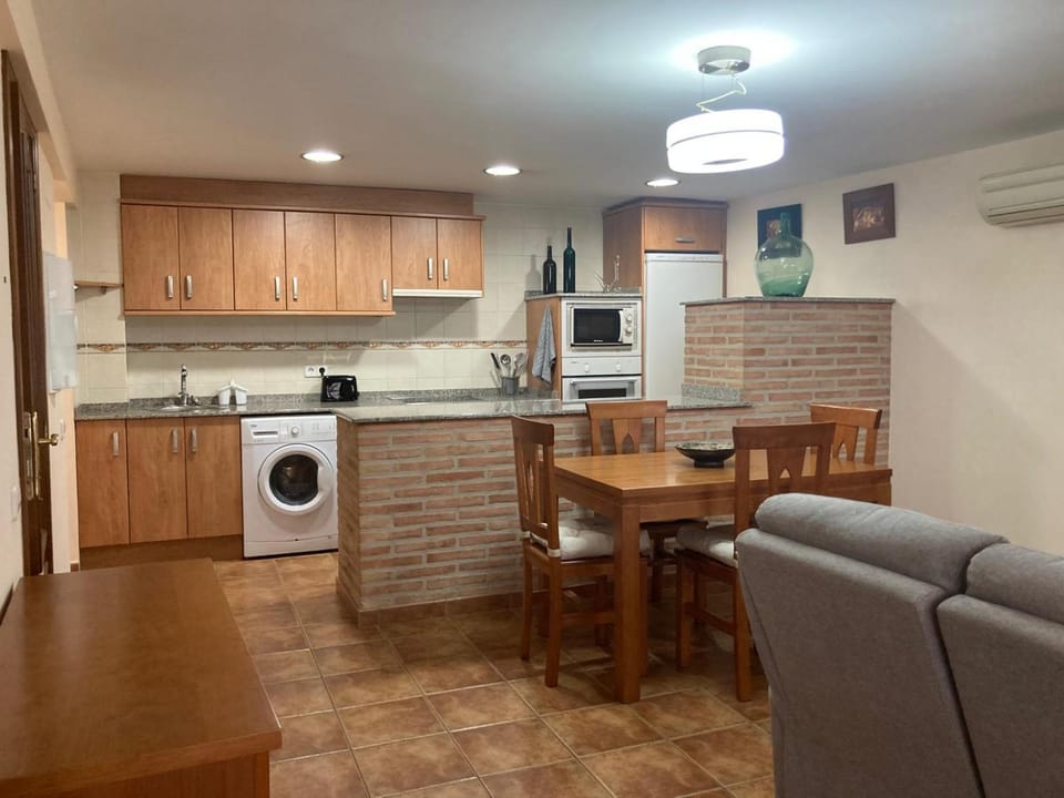 Kitchen or kitchenette, Dining area, oven, stove, toaster, washing machine
