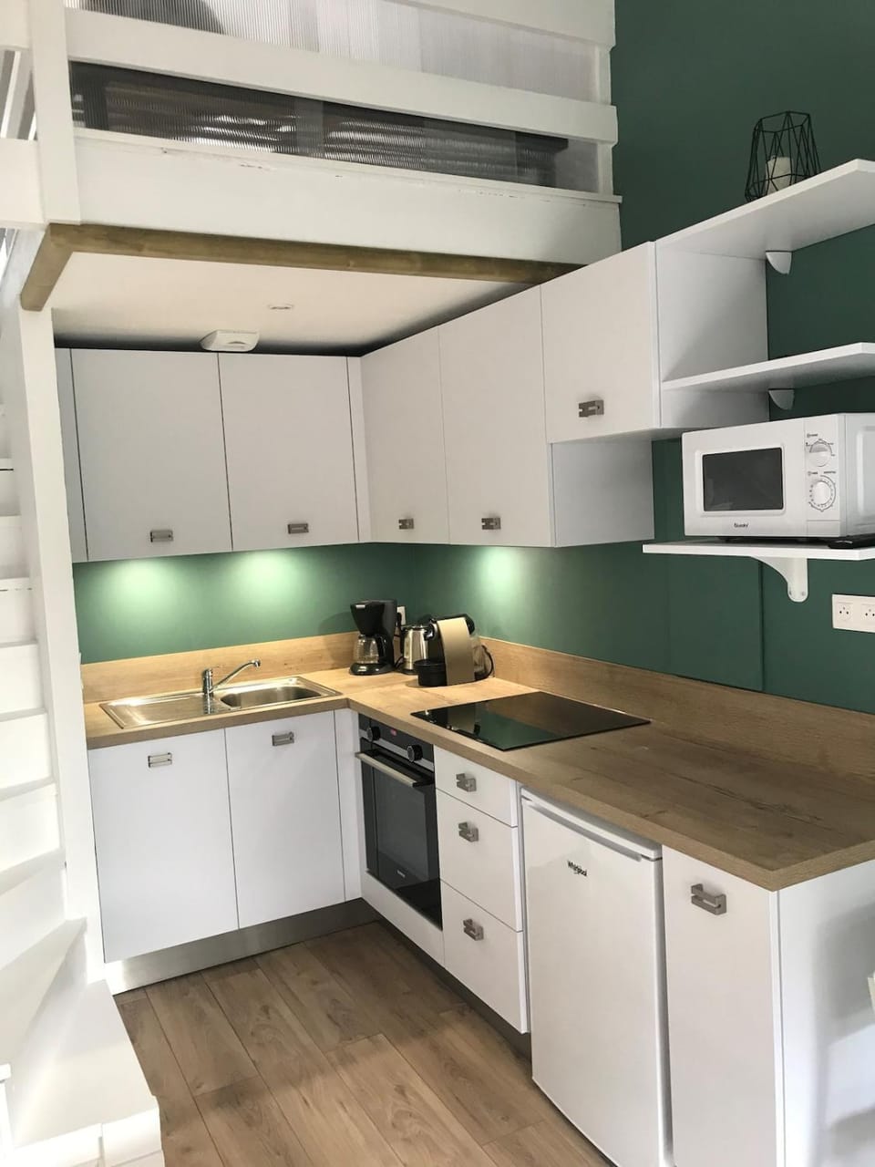 Kitchen or kitchenette, dishwasher, oven, stove