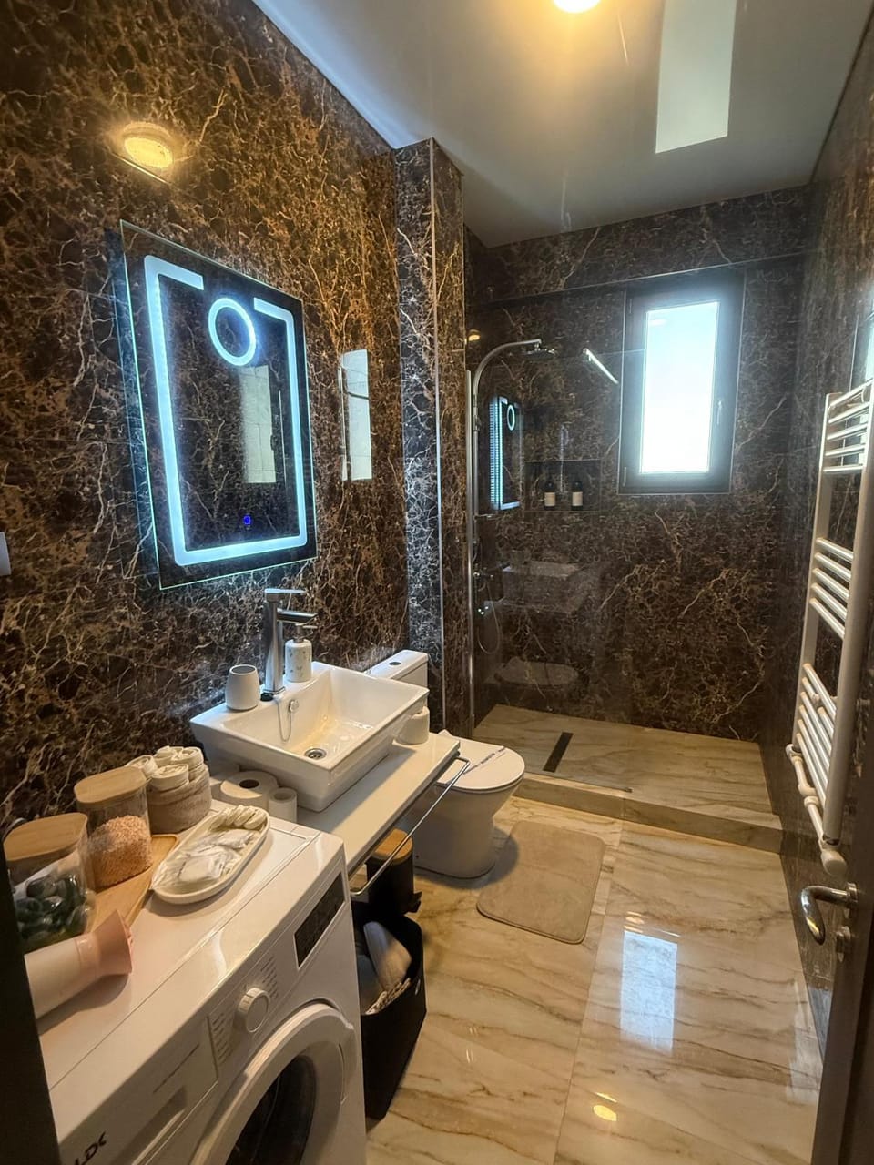 Shower, Bathroom, hair dryier, towels, washing machine