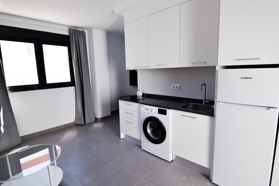 Kitchen or kitchenette, stove, washing machine