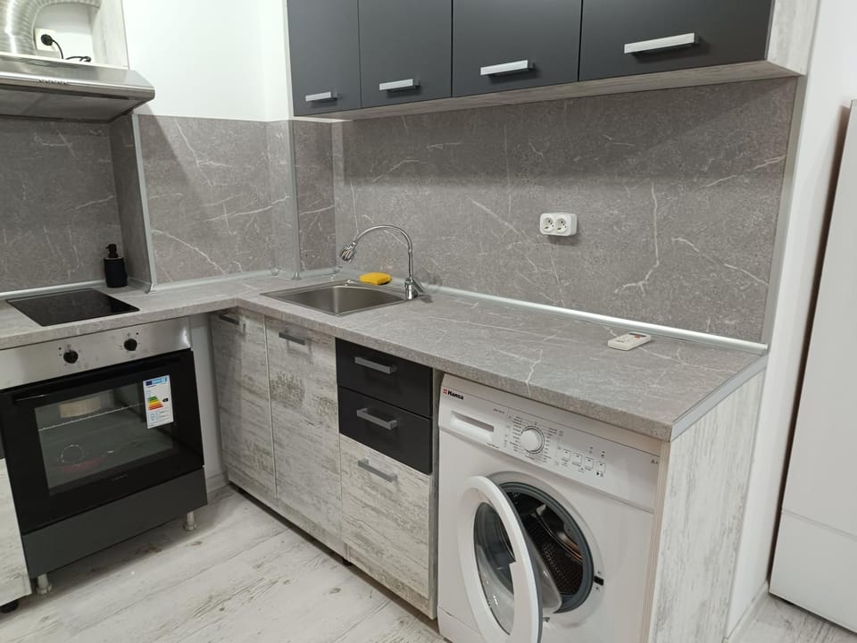 Kitchen or kitchenette, washing machine