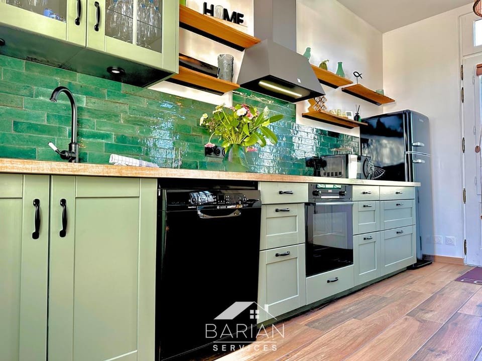 Kitchen or kitchenette, dishwasher, microwave, oven, stove