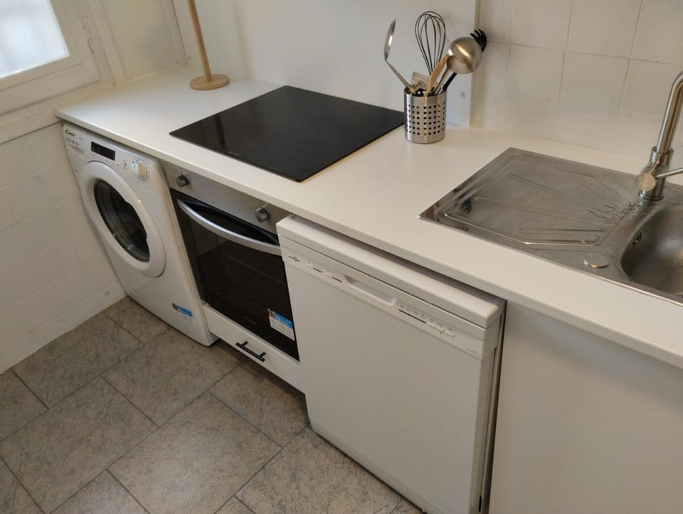Kitchen or kitchenette, dishwasher, oven, stove, washing machine