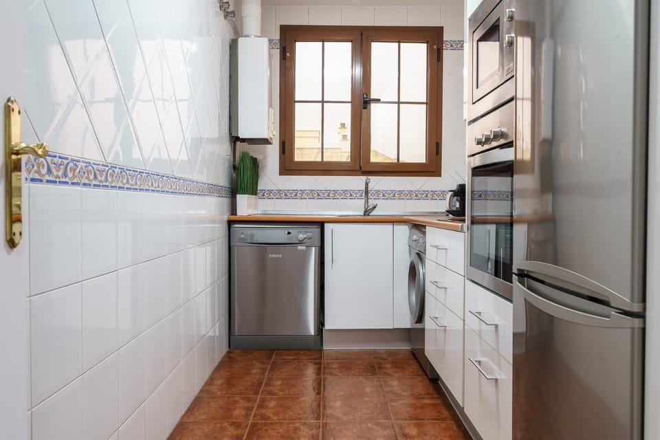 Kitchen or kitchenette, dishwasher, microwave, oven, stove, washing machine