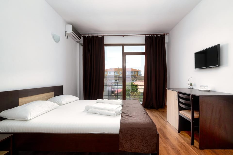Bed, Photo of the whole room, Bedroom, hair dresser, towels, air conditioner