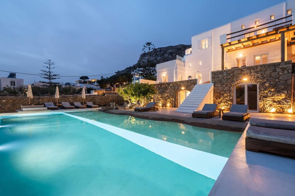 Property building, Patio, Night, Swimming pool, sunbed