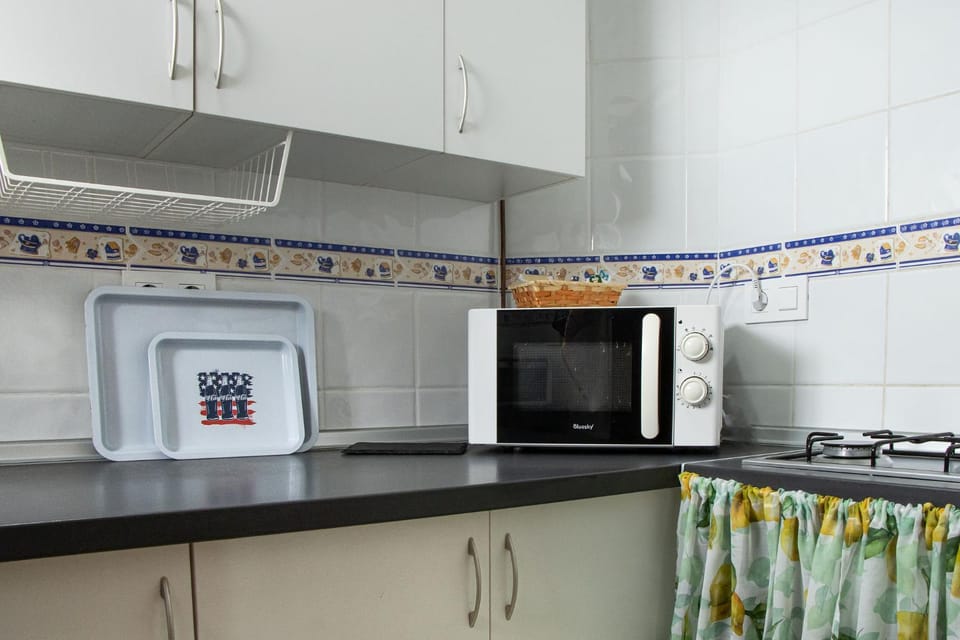 Kitchen or kitchenette, microwave, stove