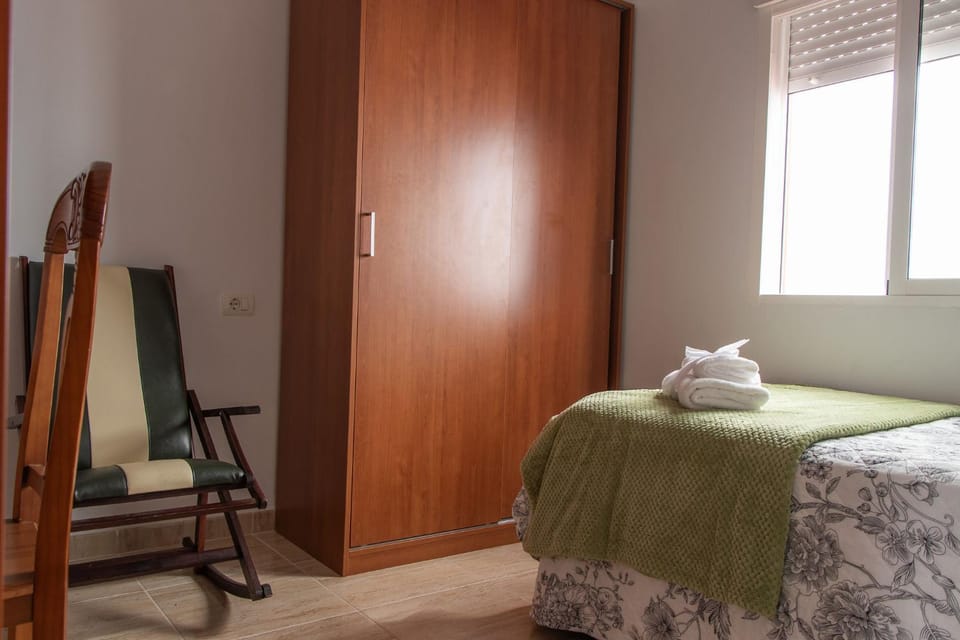 Bed, Photo of the whole room, Seating area, Bedroom, towels, wardrobe