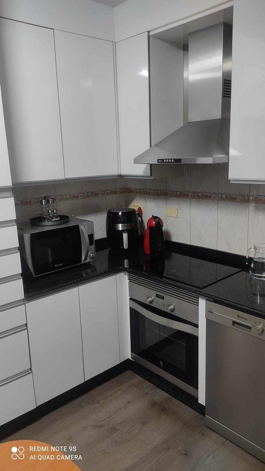 Kitchen or kitchenette, dishwasher, stove, toaster