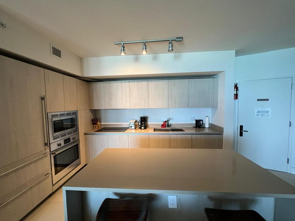 Kitchen or kitchenette, dishwasher, oven, stove, toaster
