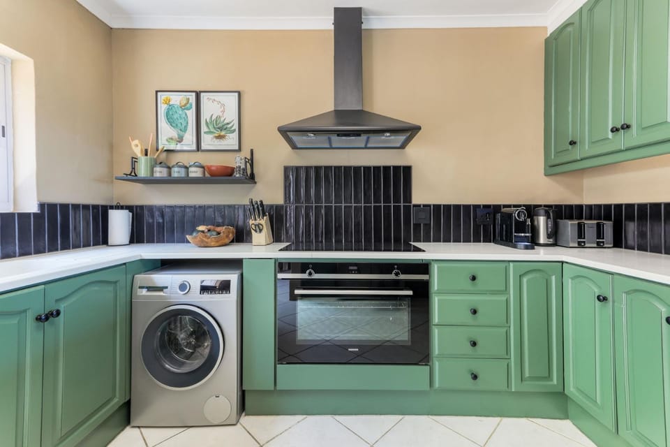 Kitchen or kitchenette, dishwasher, oven, stove, toaster, washing machine