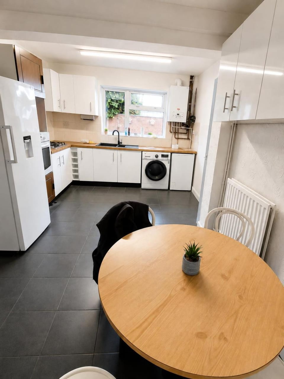 Dining area, microwave, washing machine, kitchen