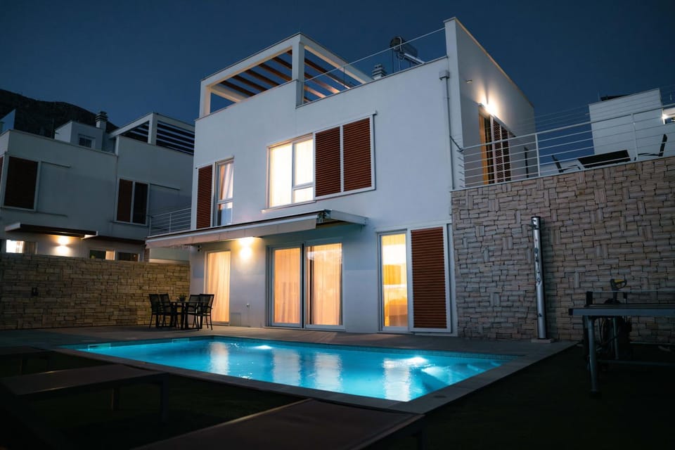 Property building, Patio, Night, Swimming pool, sunbed