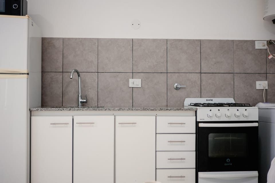 Kitchen or kitchenette, microwave, oven, stove, stove