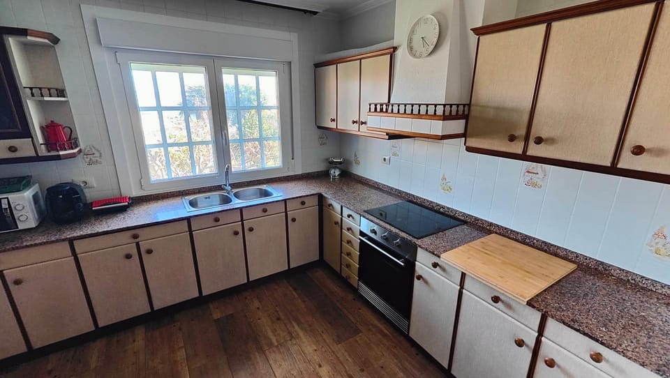 Kitchen or kitchenette, dishwasher, microwave, oven, stove