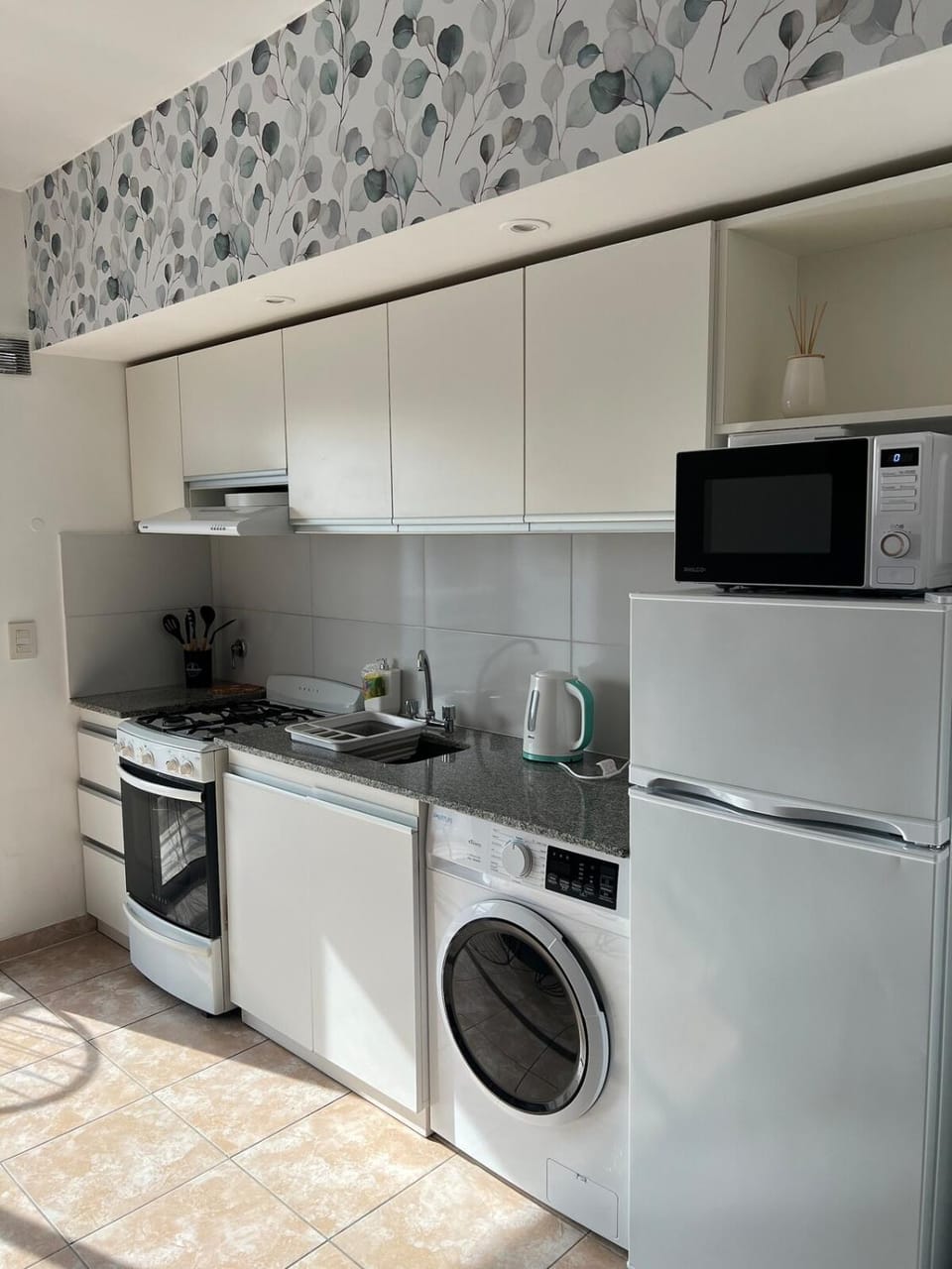 Kitchen or kitchenette, washing machine