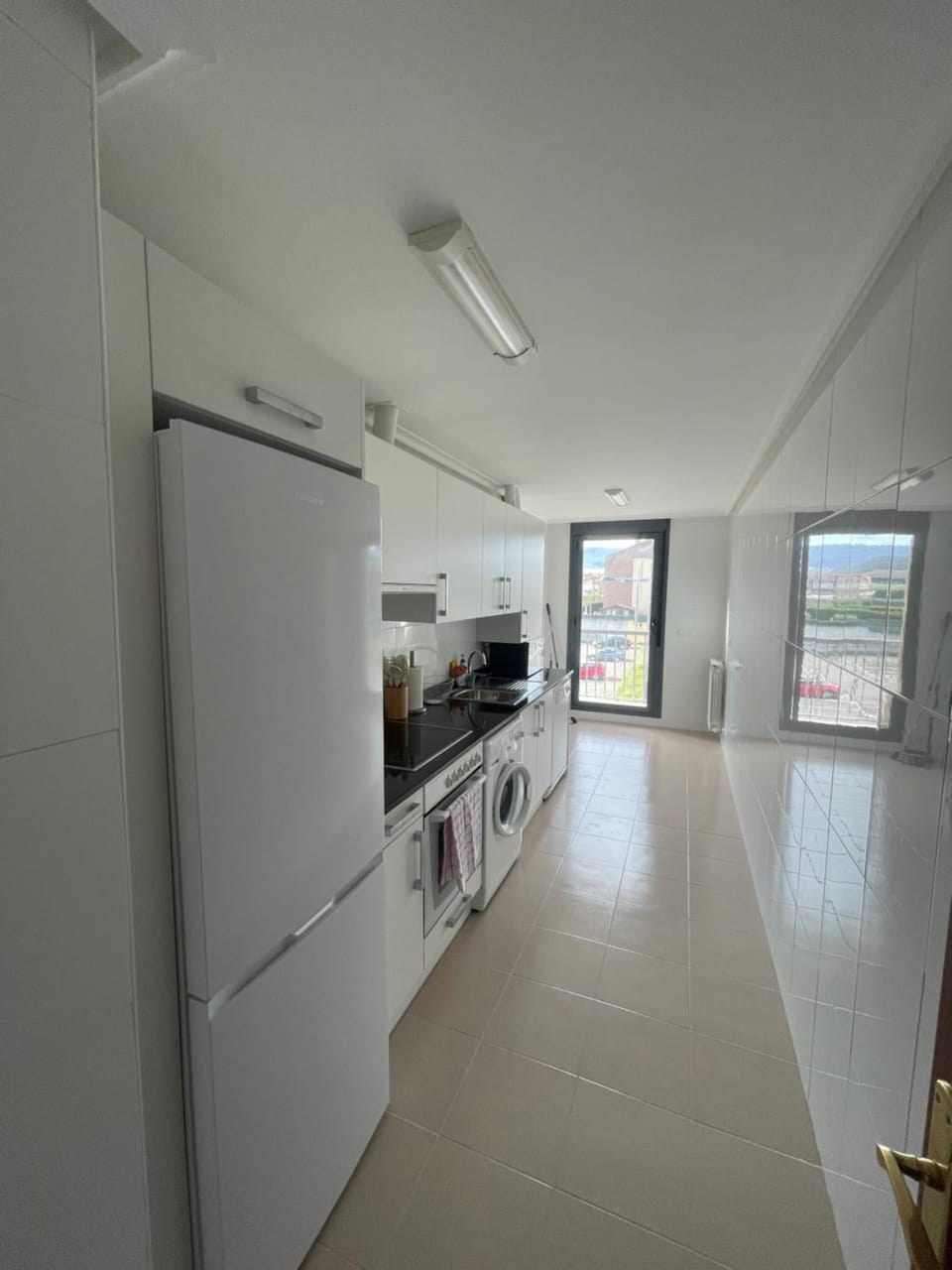 Kitchen or kitchenette, dishwasher, oven, stove