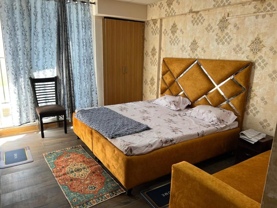 Bed, Photo of the whole room, Bedroom, hair dryier, towels, wardrobe