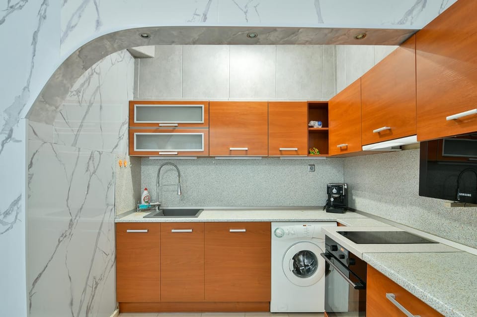 Kitchen or kitchenette, dishwasher, oven, stove, washing machine