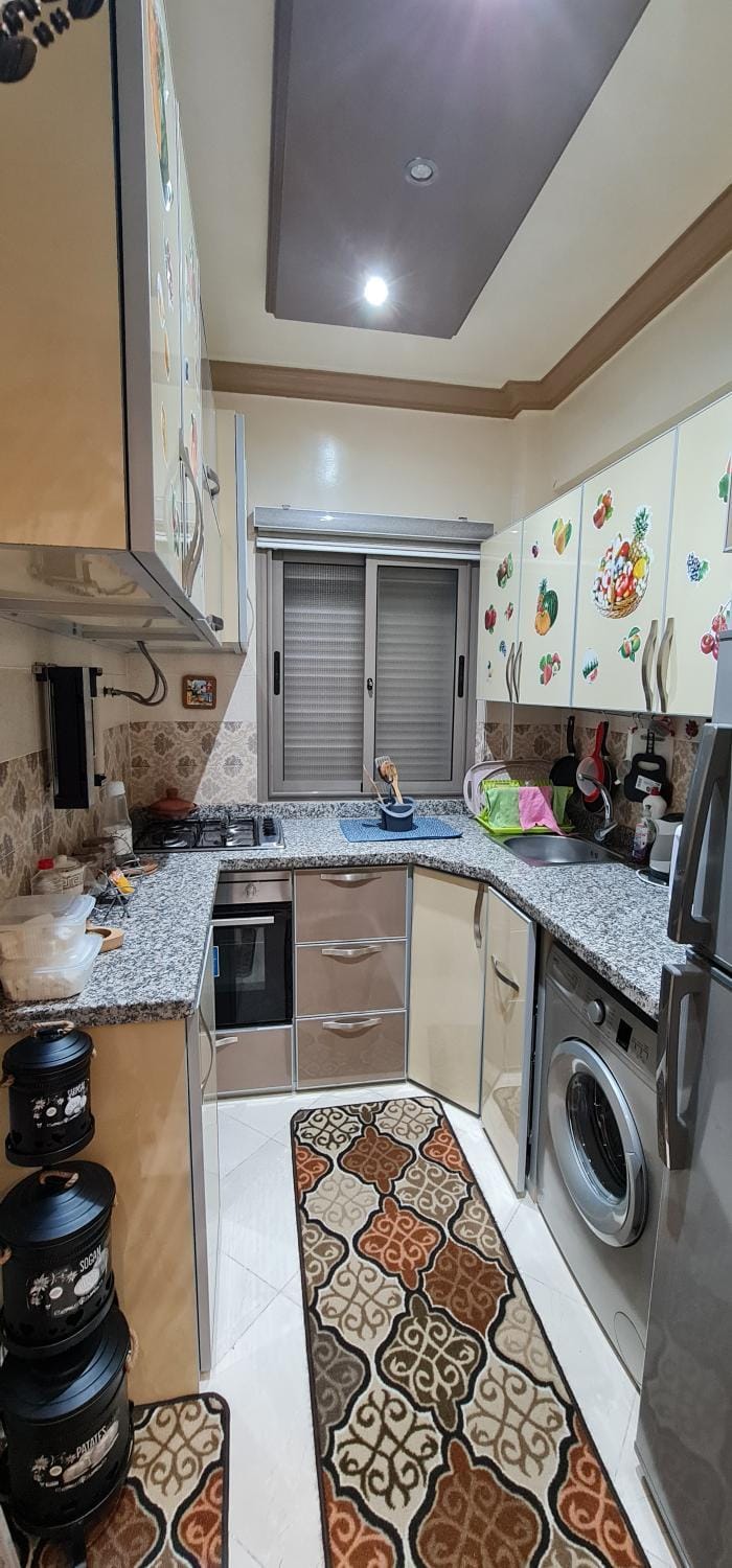 Kitchen or kitchenette, washing machine
