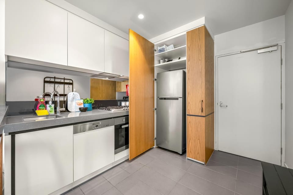 Kitchen or kitchenette, dishwasher, oven, stove