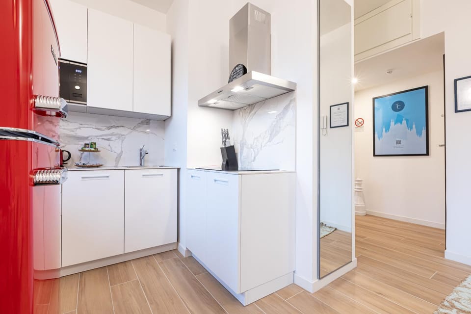 Kitchen or kitchenette, dishwasher, oven, stove