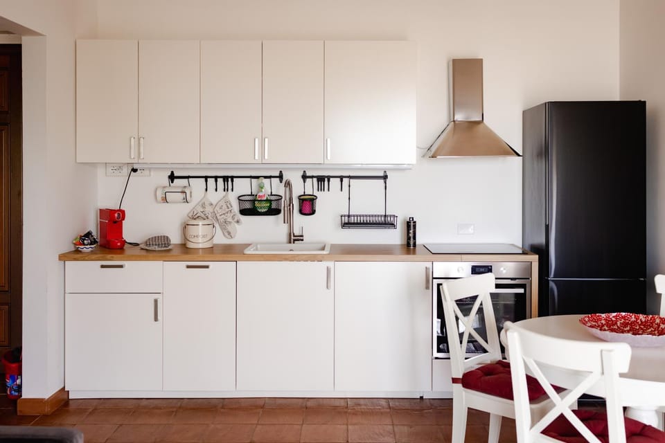 Kitchen or kitchenette, dishwasher, oven, stove, washing machine