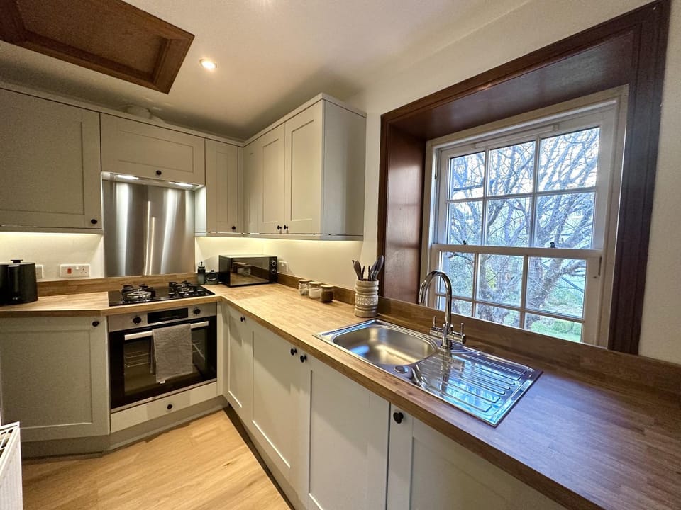 Kitchen or kitchenette, oven, stove, toaster