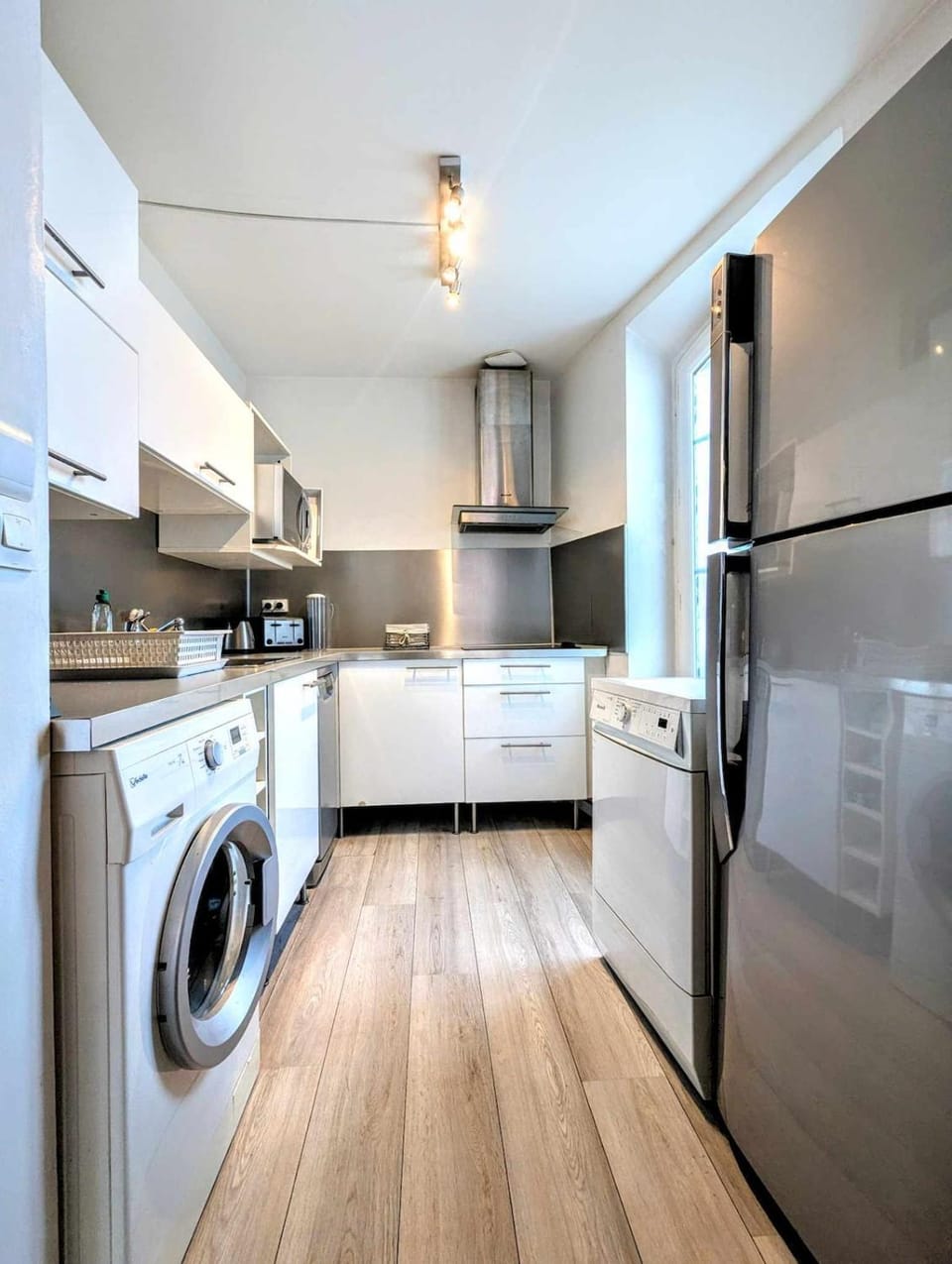 Kitchen or kitchenette, dishwasher, oven, stove, washing machine