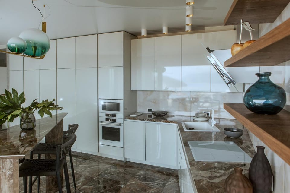 Photo of the whole room, microwave, oven, stove, wardrobe, kitchen