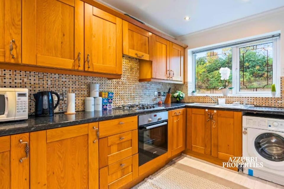 Kitchen or kitchenette, dishwasher, oven, stove, washing machine, dryer