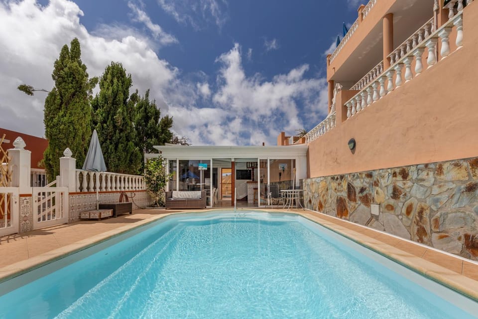Property building, Living room, Swimming pool