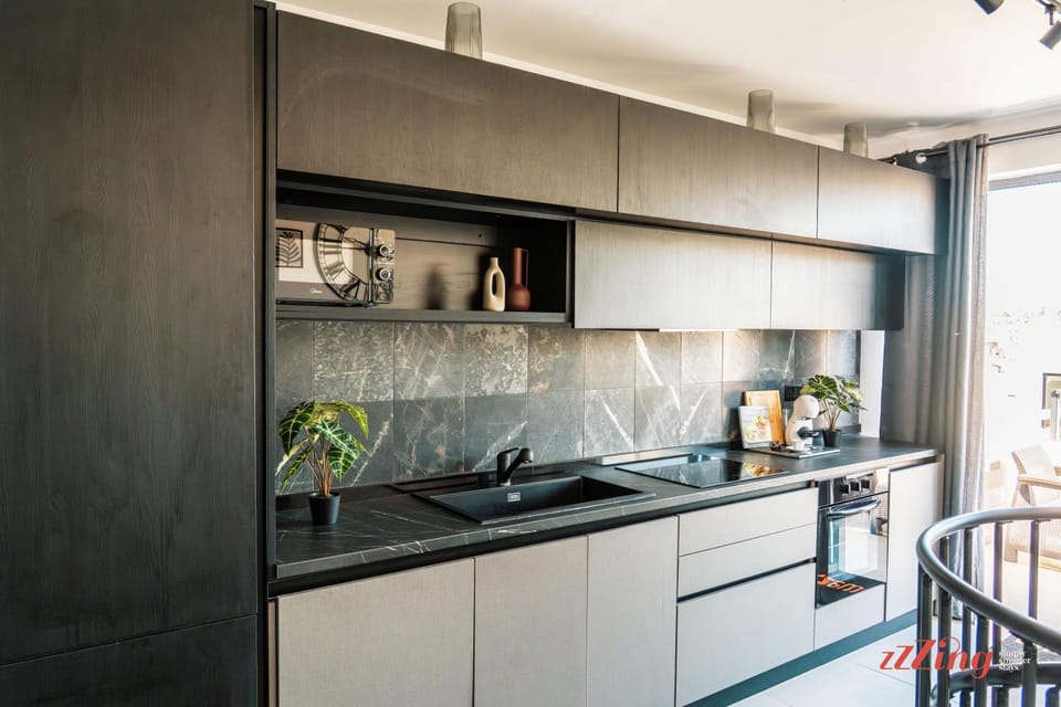 Kitchen or kitchenette, microwave, oven, stove