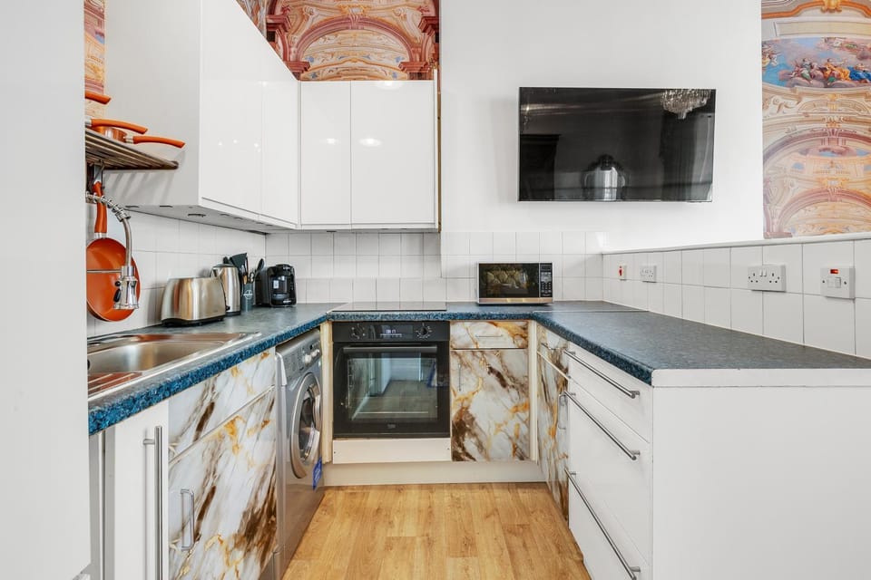 Kitchen or kitchenette, microwave, oven, stove, toaster